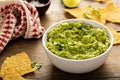 Chunky homemade guacamole in a bowl with tortilla chips Royalty Free Stock Photo