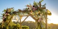 Chuppah with cascading flowers and lace cloth Royalty Free Stock Photo