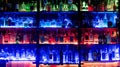 Chur, GR / Switzerland - 14 May 2019: view of the famous and iconic Cuadro 22 bar in Chur with colorful backlit shelves with many