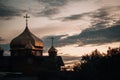 Village church on a dark warm sunset background