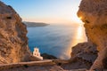 Church of Agios Nikolaos in Santorini island, Greece. View of the sea and rocks at sunset Royalty Free Stock Photo