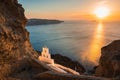 Church of Agios Nikolaos in Santorini island, Greece. View of the sea and volcanic rocks at sunset Royalty Free Stock Photo