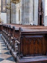 Church aisle with ornamental wooden pews Royalty Free Stock Photo