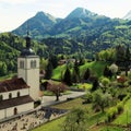 Church and Alps mountains, Gruyeres, Switzerland