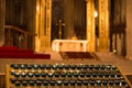 Church alter with candles lit in foreground