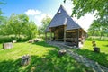 Old traditional wooden barn in the Church of the Archangels Michael and Gabriel yard, Surdesti village, Maramures county, Romania. Royalty Free Stock Photo