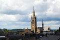 Church of arlon over the roofs of the old town against a cloudy Royalty Free Stock Photo