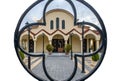 The church of the Ascension of Christ the Savior photographed through the iron main gate in the shape of a cross. Rafina city,