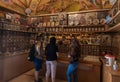 The church attendant talking to visitors in the Church of the Apostles located on the shores of the Sea of Galilee, not far from Royalty Free Stock Photo