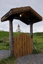 Church in background of Modrudalur farm entrance gate, Iceland