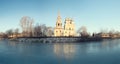 Church on the banks of the frozen river Royalty Free Stock Photo