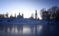 Church on the banks of the frozen river ice winter Royalty Free Stock Photo