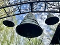 Church bell against the blue sky. Ancient bells in the courtyard of the old castle. Bell tower of the old church Royalty Free Stock Photo