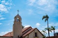 church bell tower with rpalm trees Royalty Free Stock Photo