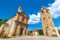 Church and bell tower under blue sky in Monforte d`Alba, Italy. Royalty Free Stock Photo