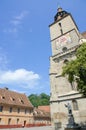 The church Biserica Neagra (The Black Church) situated near the square Piata Sfatului, and the Statue of Johannes Honterus. Royalty Free Stock Photo