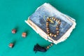 Church book, worry beads and three wooden dices