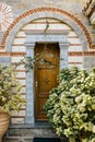 Church building door adorned with flowers in Horb am Neckar