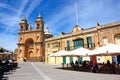 Church and cafe in Marsaxlokk town square, Malta.