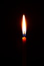 church candle burning in the dark creates a spiritual atmosphere Royalty Free Stock Photo