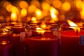 Church candles in red transparent chandeliers Royalty Free Stock Photo