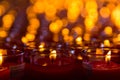 Church candles in red transparent chandeliers Royalty Free Stock Photo