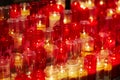 Church candles in red and yellow transparent chandeliers Royalty Free Stock Photo