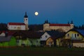 Church and castle at full moon, Velika Nedelja, Slovenia