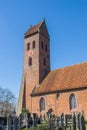 Church and cemetary in small village Midwolde