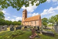 Church with cemetery surrounded by big trees