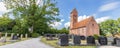 Church with cemetery surrounded by big trees