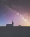 Church chapel silhouette with night sky showing galaxy space and stars with shooting star at St Cyrus Angus Scotland UK Royalty Free Stock Photo