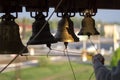 Church chimes and knot of ropes in hand of bell-ringer on belfry Royalty Free Stock Photo