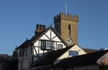 Church clock tower with timber building