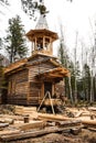 Church construction process. construction of a wooden chapel in a pine forest. Royalty Free Stock Photo