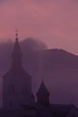 Church covered in mist with sunlit cloud, Bohinj