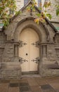 Church cream double door set in stone archway