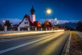 The church in Czarna Gora and the road to the Tatra Mountains at dusk. Poland Royalty Free Stock Photo