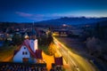 The church in Czarna Gora and the road to the Tatra Mountains at dusk. Poland Royalty Free Stock Photo