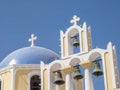 A church dome and four bells in fira, santorini