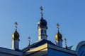 Domes of the church with golden crosses against the clear blue sky Royalty Free Stock Photo