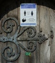 Church door with Covid 19 notice.