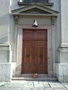 Church door with flower pot Royalty Free Stock Photo