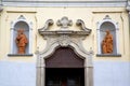 church door in italy lombardy shield statue