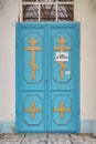 Church doors a blue color with an inscription on a white sheet sorry quarantine Royalty Free Stock Photo