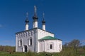 Church of the Entry into Jerusalem 1707 with black domes and crosses shining in the spring sun. Suzdal, Golden Ring of Russia