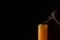 Church extinguished candle on dark background, closeup. Space for text Royalty Free Stock Photo