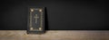 Church faith Christian background banner panorama - Old holy bible with golden cross on old rustic vintage wooden table and black Royalty Free Stock Photo