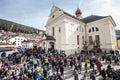 Church and the faithful. Easter in Ortisei, Italy. Royalty Free Stock Photo