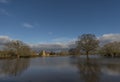 Church and flooded fields with reflexions near Tewkesbury. Royalty Free Stock Photo